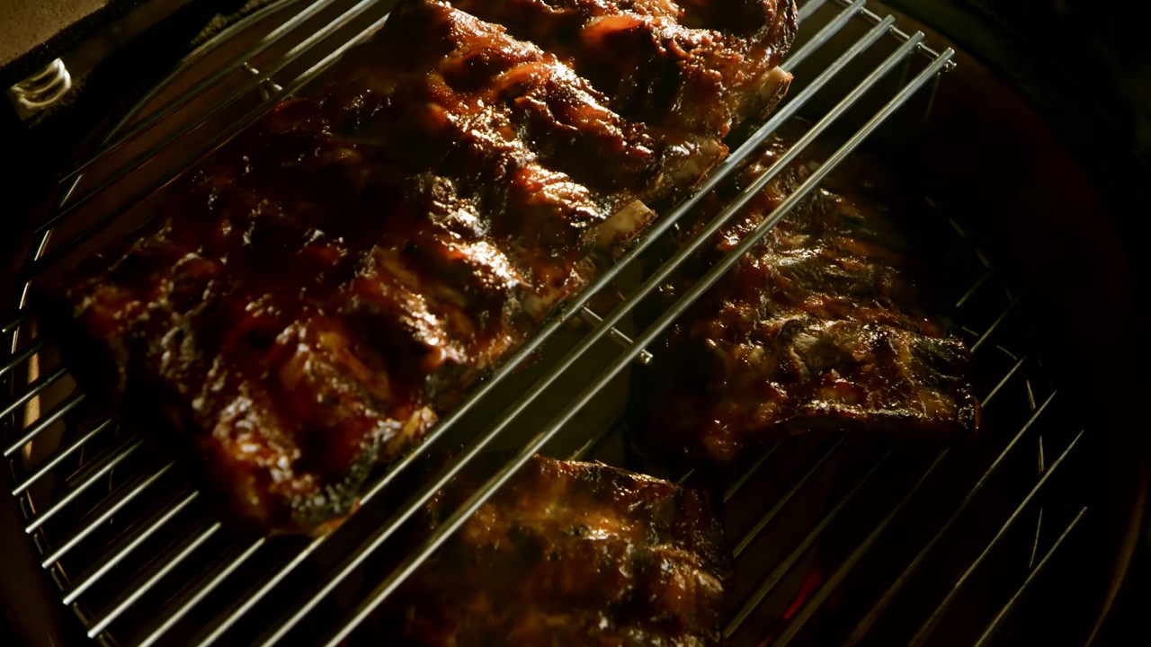 Kamado grill teaser — ribs on the grill